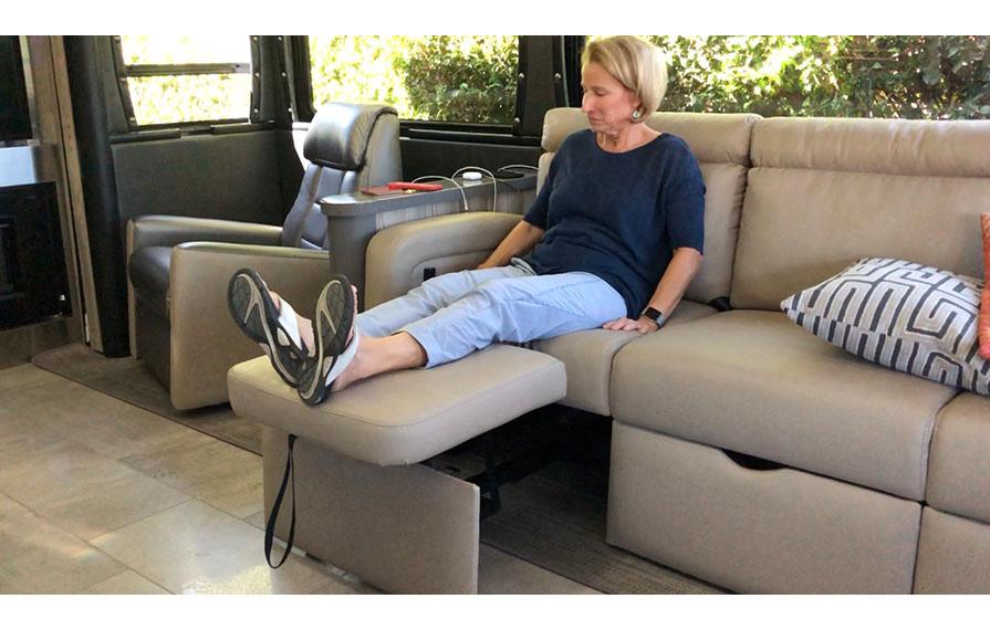 Terry sitting on sofa with feat up